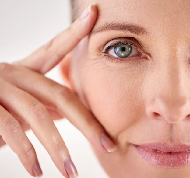 Close-up of a middle-aged woman's face focusing on her eye.